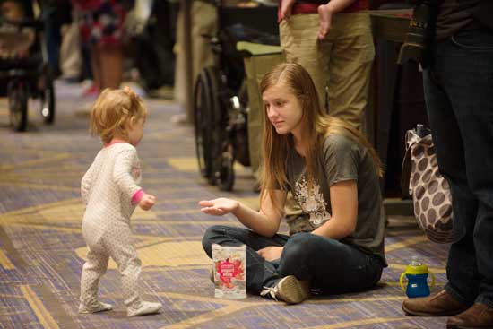 Baby & Little Sister on convention floor with snacks Blogging Life or Living Life