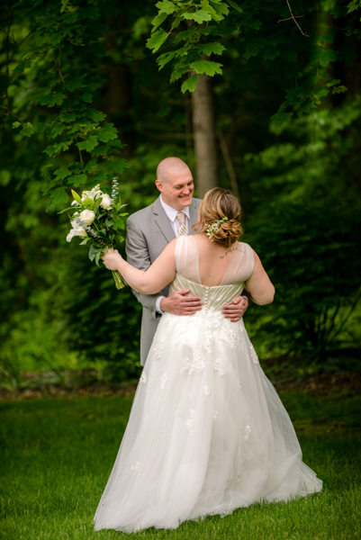 Bride and groom 'first look outdoor at wooded area at fawn hollow acres