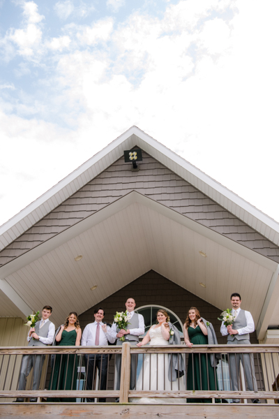 wedding party standing on balcony at Fawn Hollow Acres 