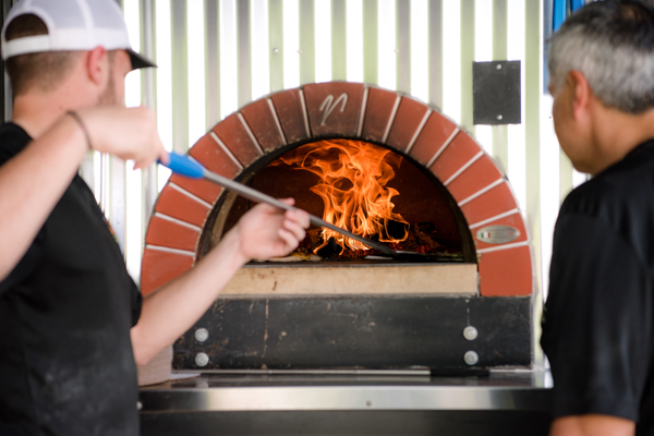 Nooner's wood fire oven on their pizza truck at fawn hollow acres