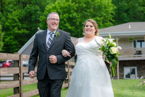 Father walking bride down isle at spring wedding at Fawn Hollow Acres