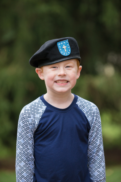 Army son wearing Dad's beret