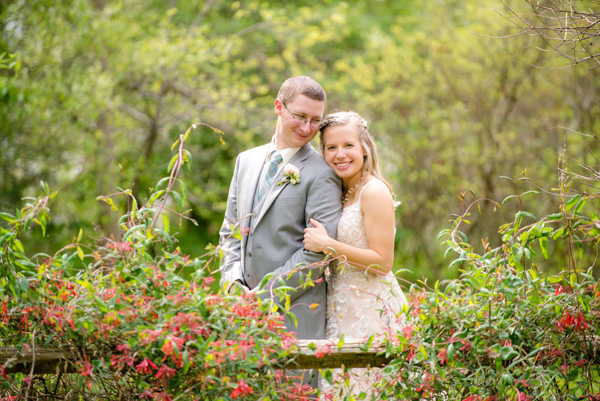 J and D studio bride and groom outdoor photo in flowers with blurry background Kings Gap, Carlisle, PA
