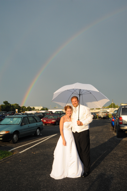rainbow above bride and groom