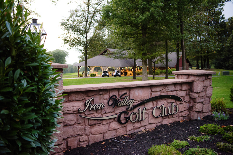 Iron Valley Golf Course sign with reception pavilion lit up in the background. Taken by J & D Studio, Harrisburg Photographers